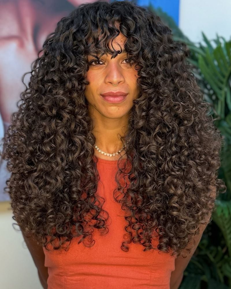 Mid-Back Layers With Voluminous Curly Bangs — Simple Curly Bangs