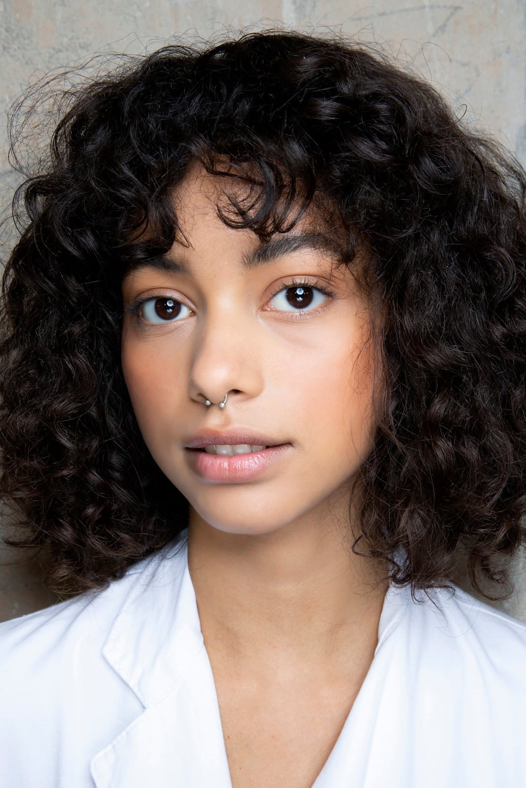 Dark Brown Chin Bob With Short Bangs and Natural Curls — Simple Curly Bob Hairstyles
