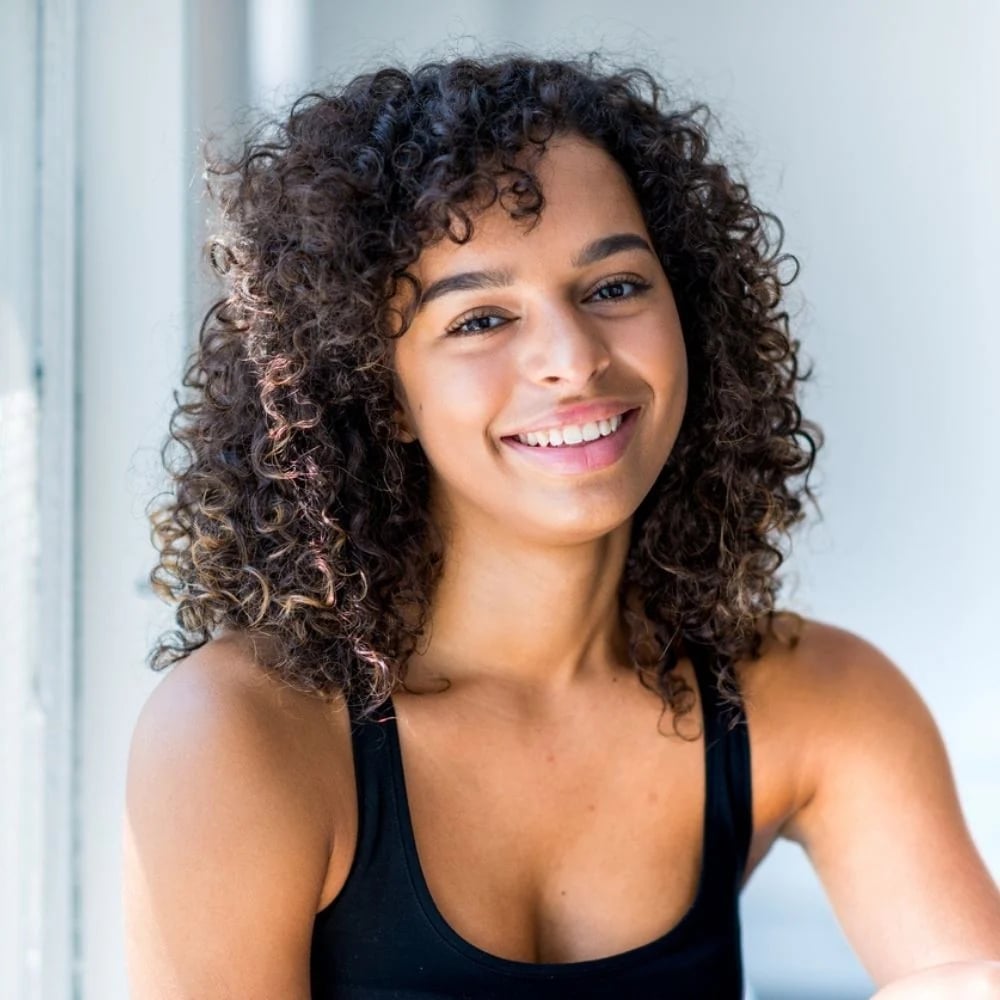 Collarbone Layers With Subtle Caramel Highlights and Air Dried — Simple Curly Hair Highlights