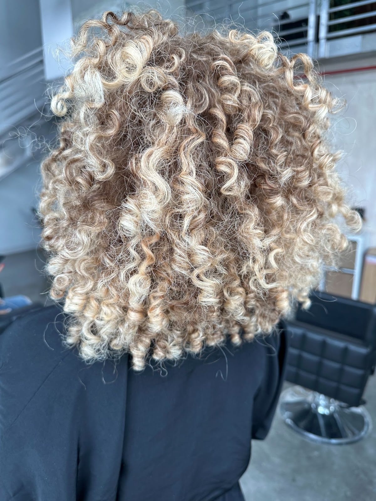 Collarbone Layers With Subtle Caramel Highlights and Textured Manner — Simple Curly Hair Highlights