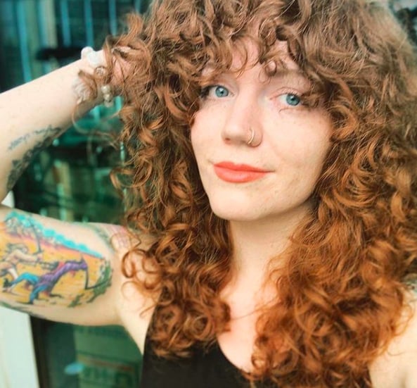 Collarbone Red Shag With Curly Bangs and Face-Framing Layers Collarbone Red Shag With Curly Bangs and Face-Framing Layers — Simple Curly Shag