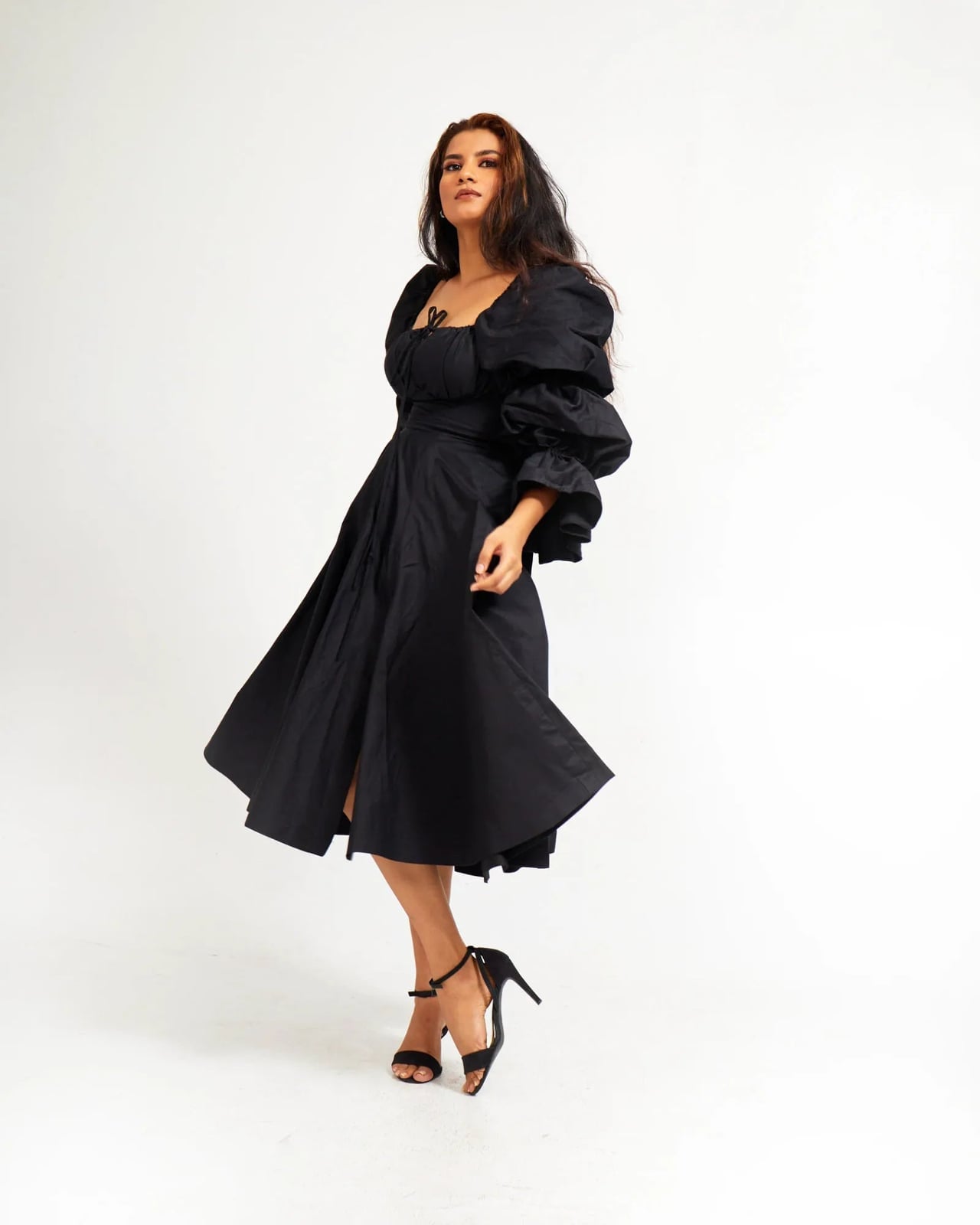 Black Midi Dress with Puff Sleeves and Voluminous Skirt — Simple Dinner Party Outfits