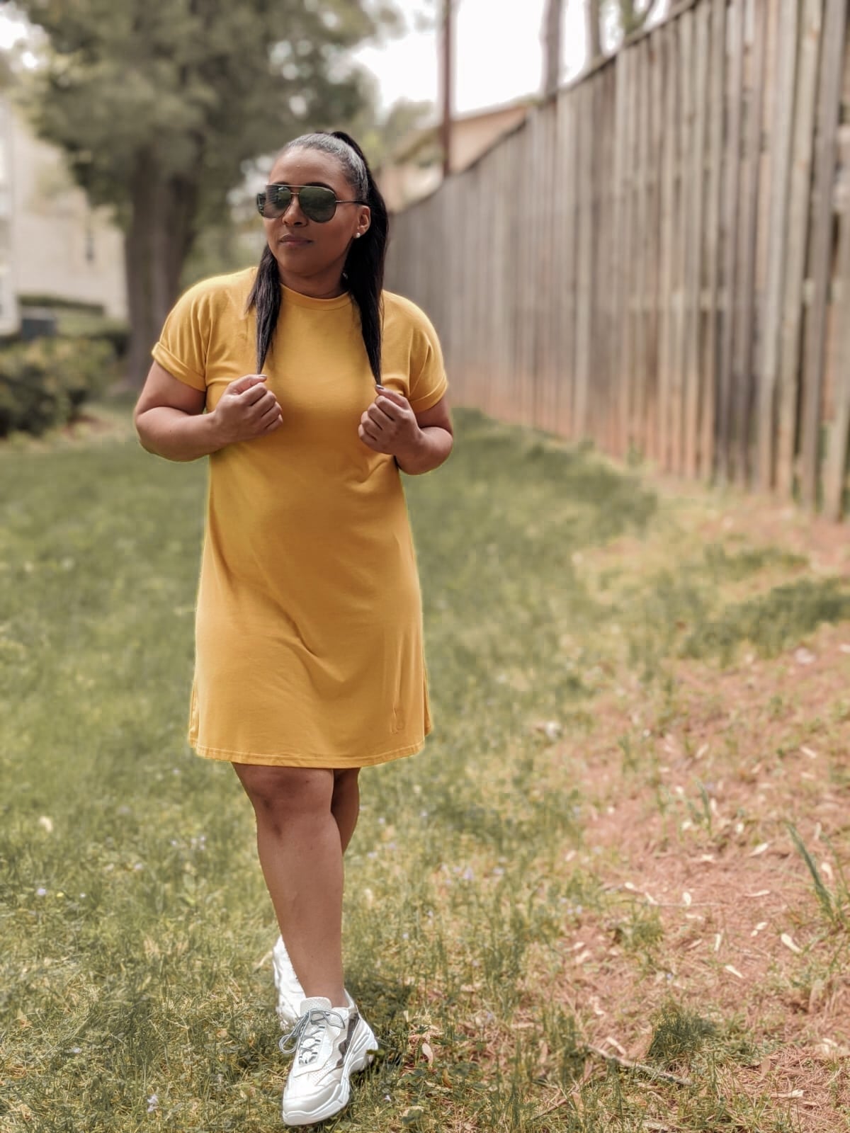 Yellow T-Shirt Dress With Chunky White Sneakers, Close-Up Take — Simple Dress with Sneakers