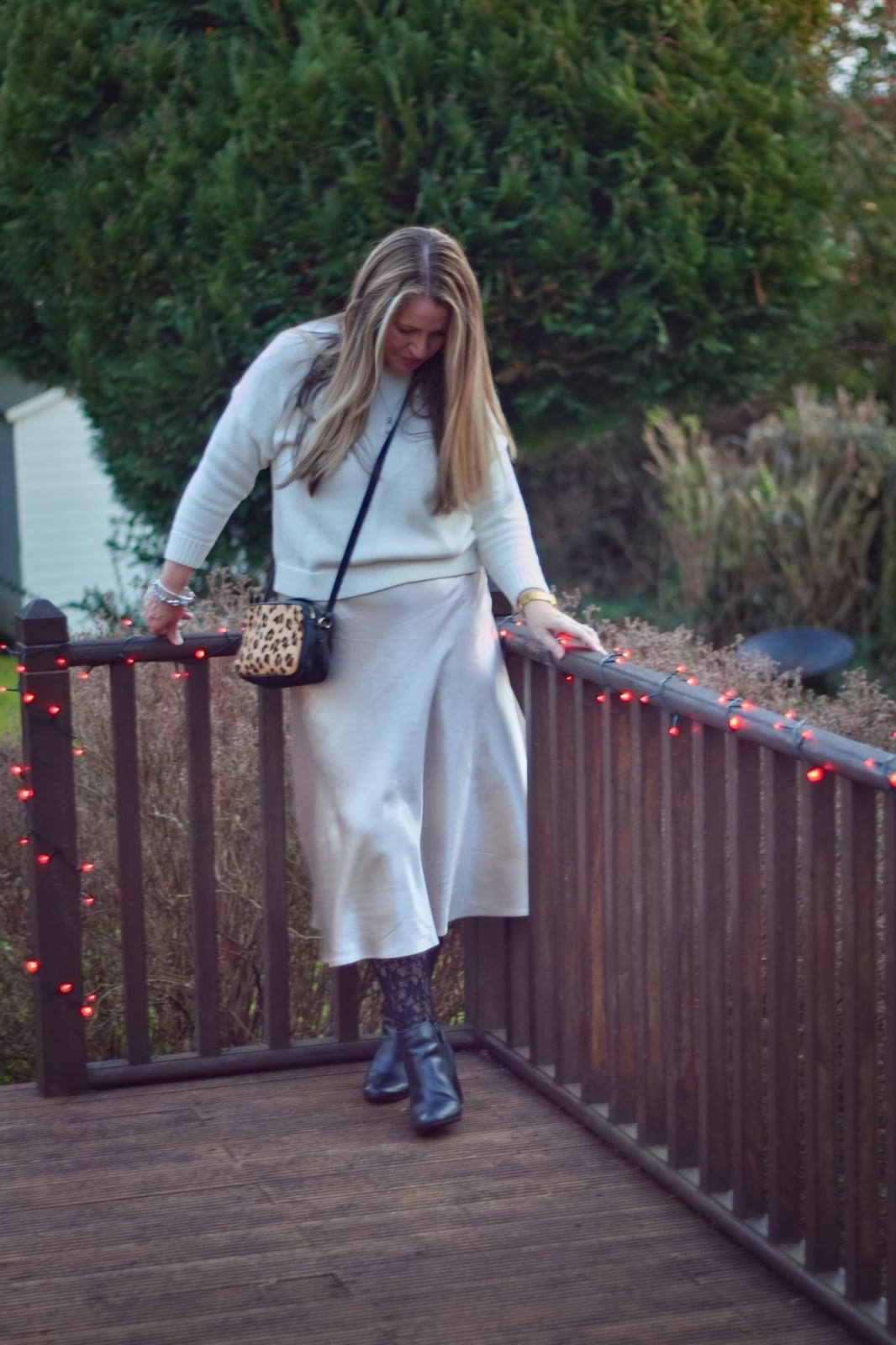 Cream Sweater Over Satin Slip Skirt with Black Ankle Boots — Simple Dresses and Boots Outfit