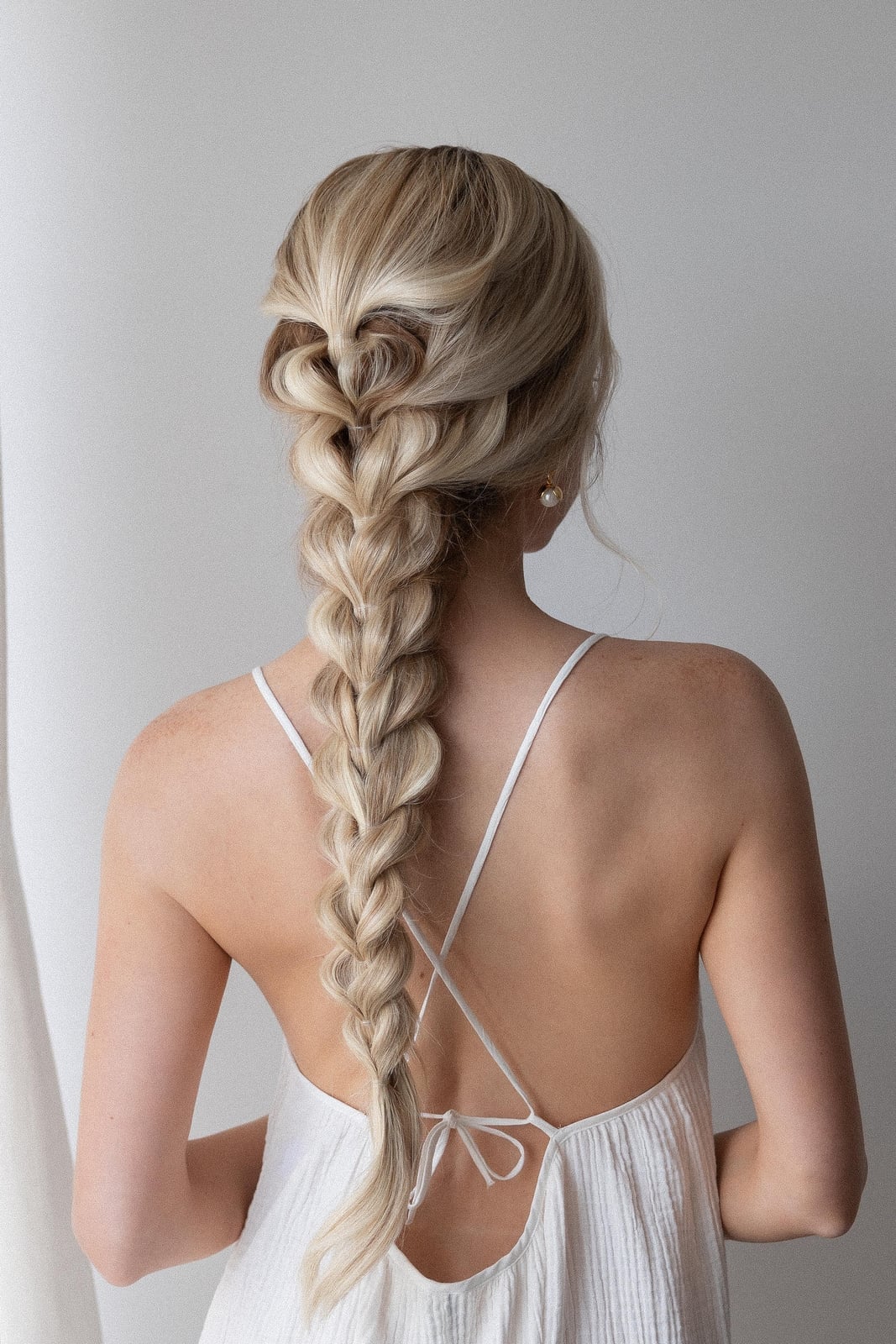 Mid-Back Blonde Fishtail Braid With Loose Strands, Wavy Mid-Back Blonde Fishtail Braid With Loose Strands, Wavy — Simple Extensions Hairstyles