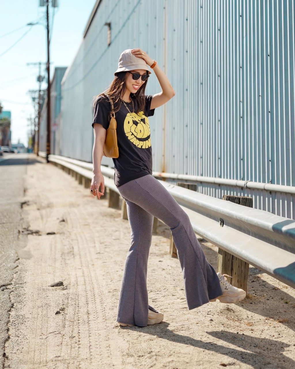 Graphic T-Shirt and Bucket Hat Streetwear Style, Close-Up Take — Simple Flare Leggings Outfits
