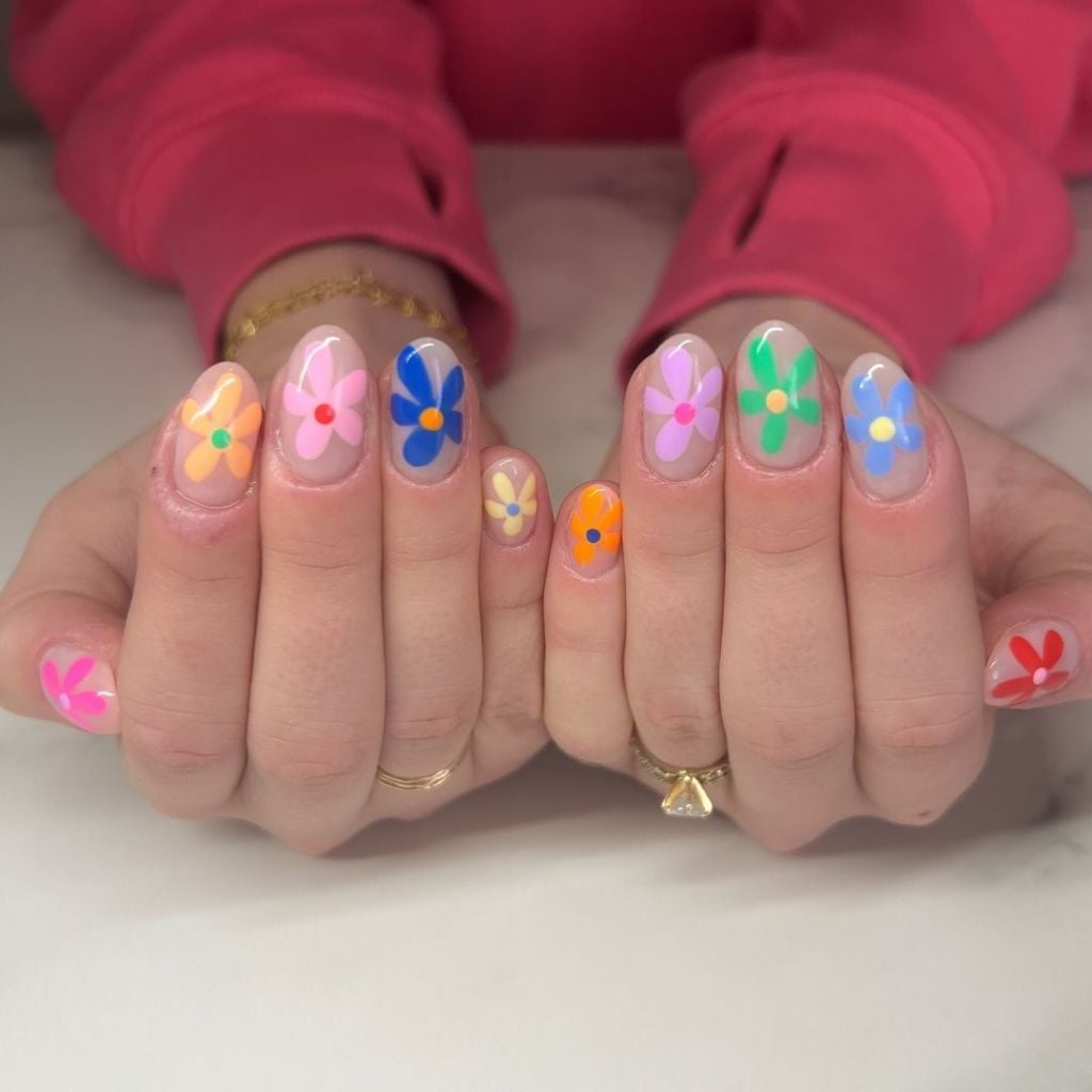Clear Base with Vibrant Multi-Colored Floral Designs Clear Base with Vibrant Multi-Colored Floral Designs — Simple Floral Nails