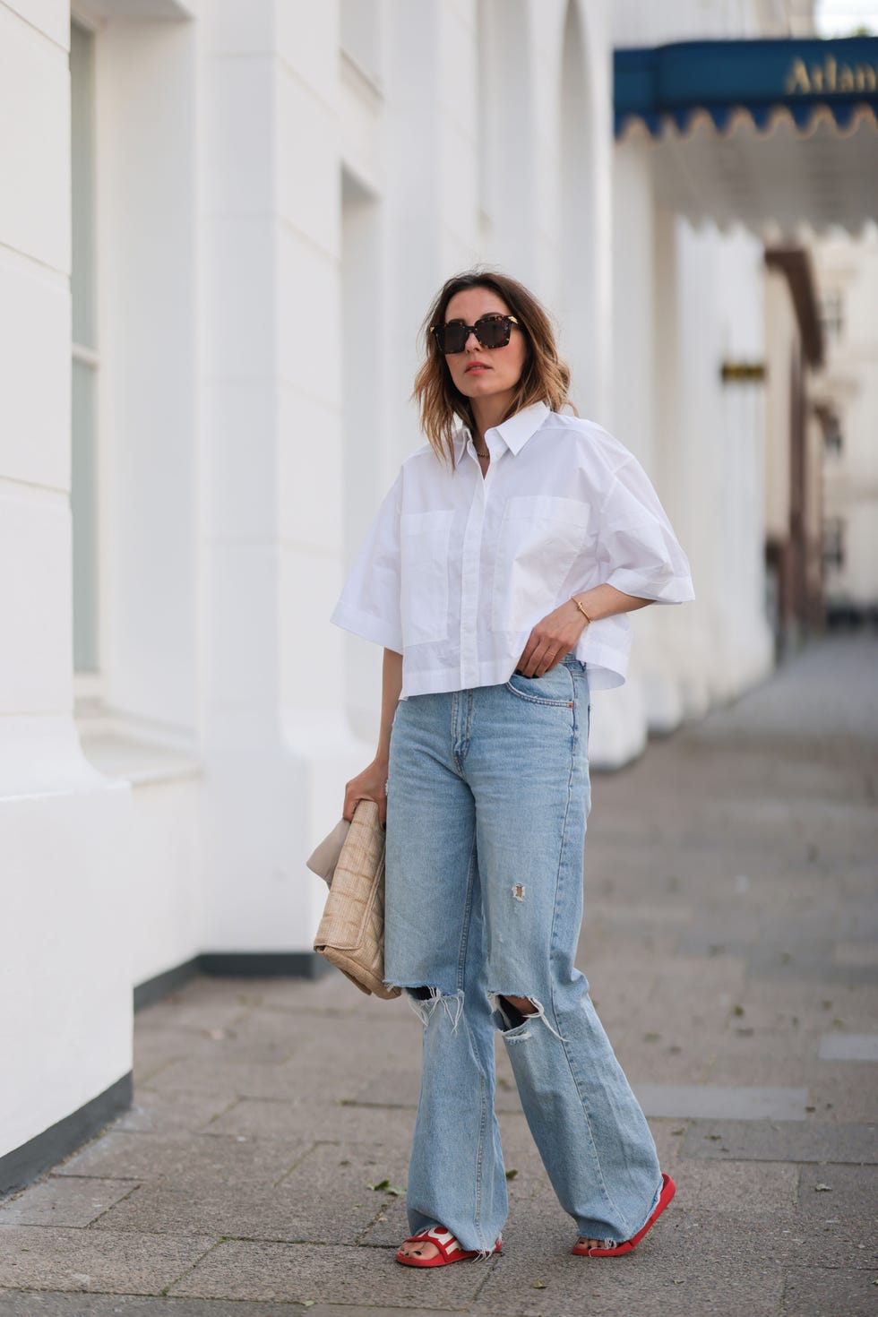 Oversized Button-Down Shirt with Ripped Wide-Leg Jeans Oversized Button-Down Shirt with Ripped Wide-Leg Jeans — Simple Game Day Outfits