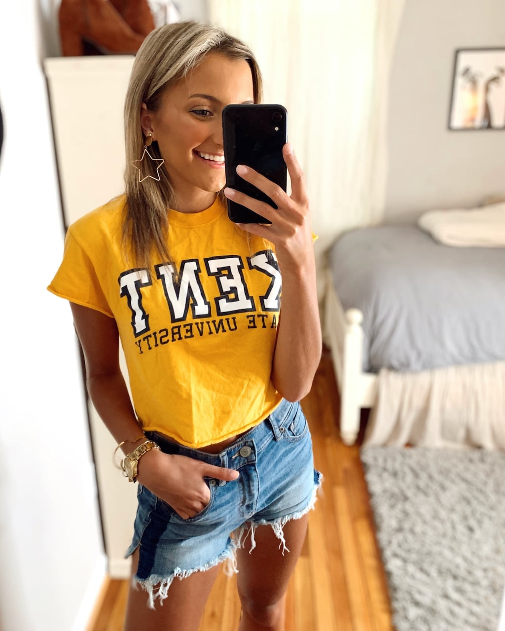 Yellow Graphic Tee and Distressed Denim Shorts for a Casual Vibe Yellow Graphic Tee and Distressed Denim Shorts for a Casual Vibe — Simple Game Day Outfits