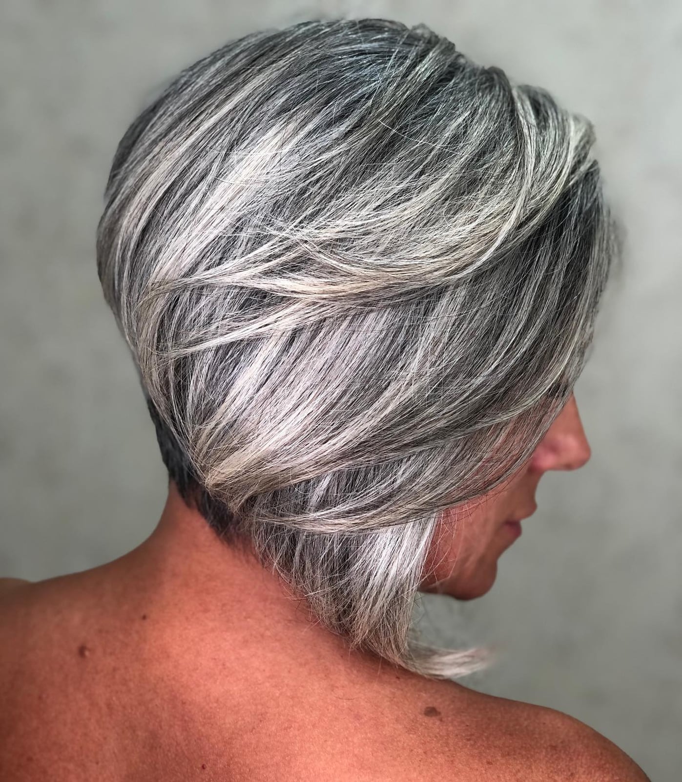 Short Bob With Stacked Layers And Grey Highlights — Simple Grey Highlights