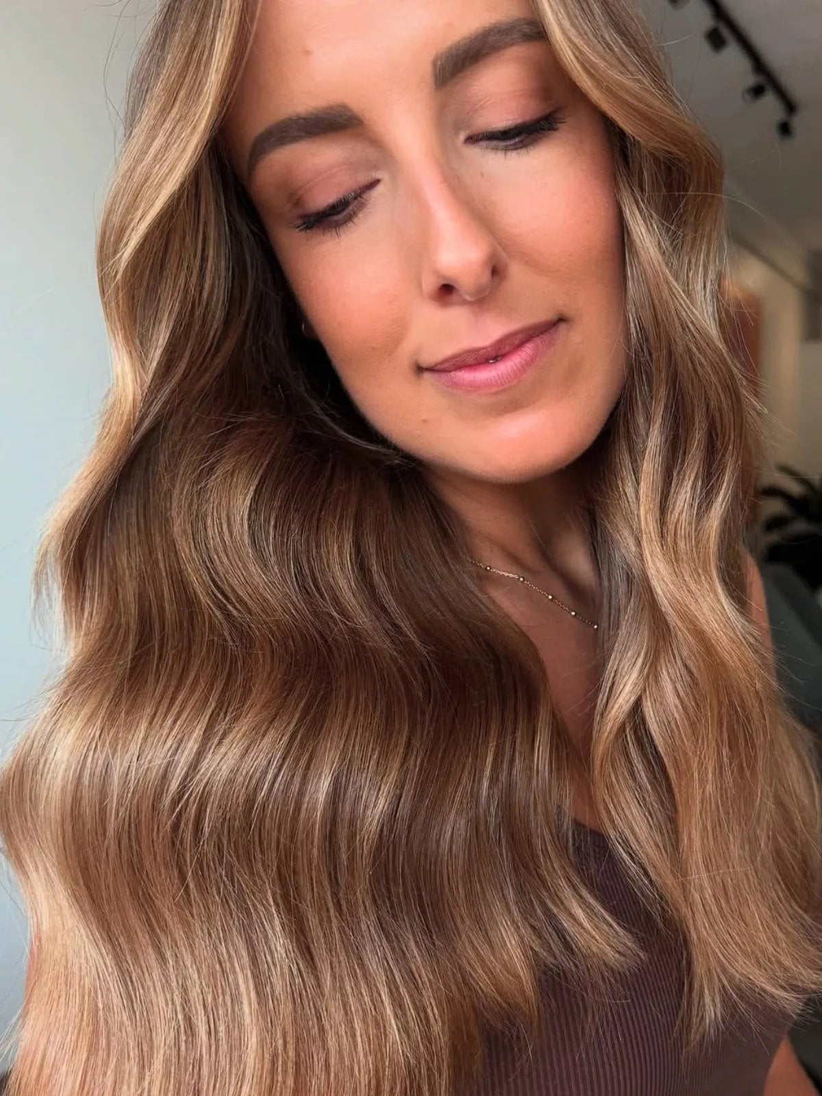 Mid-Back Dark Blonde With Curtain Bangs — Simple Hair Color for Pale Skin