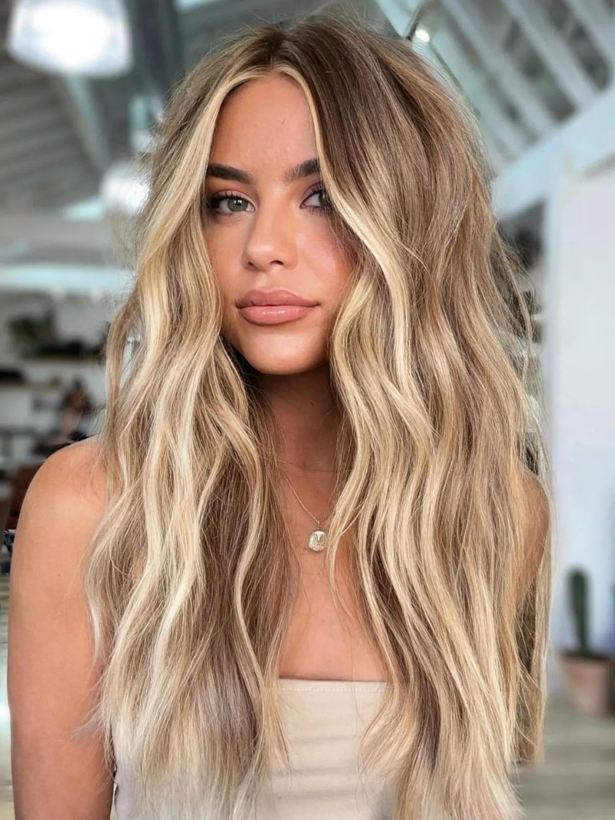 Mid-Back Bright Ash Blonde With Heavy Highlights and Curtain Bangs — Simple Hair Color for Pale Skin