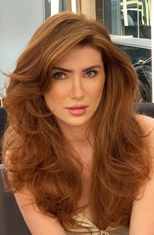 Shoulder Length Copper Red Voluminous Blowout — Simple Hair Color for Pale Skin