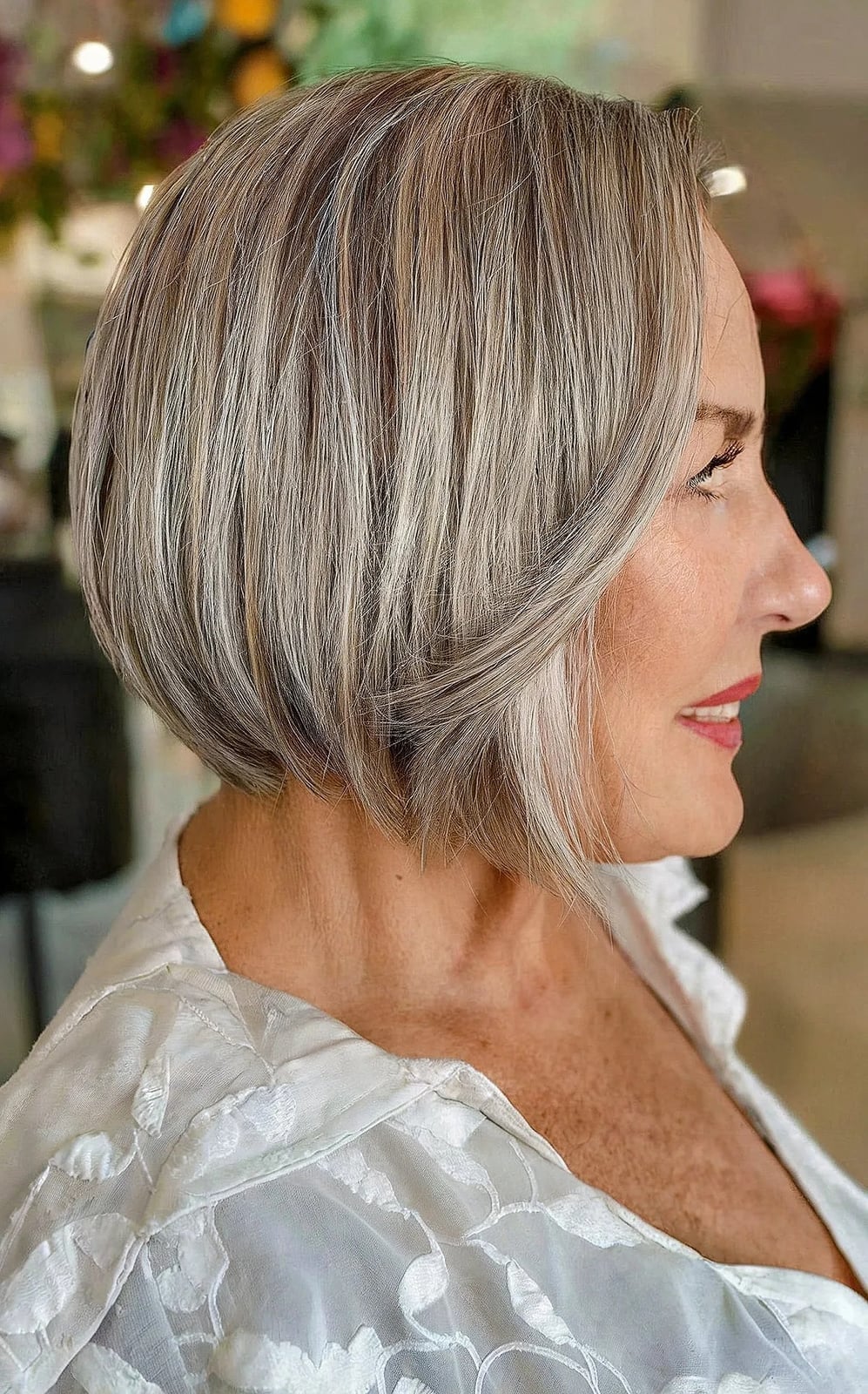 Sleek Ash Blonde Bob Tucked Behind Ear — Simple Haircuts for Older Women