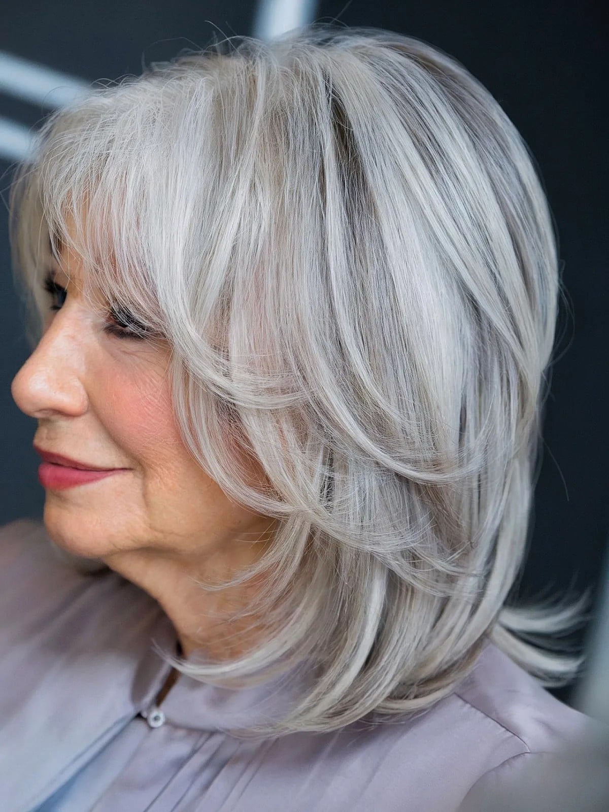 Silver Grey Shoulder Length Shag With Feathered Bangs — Simple Haircuts for Older Women