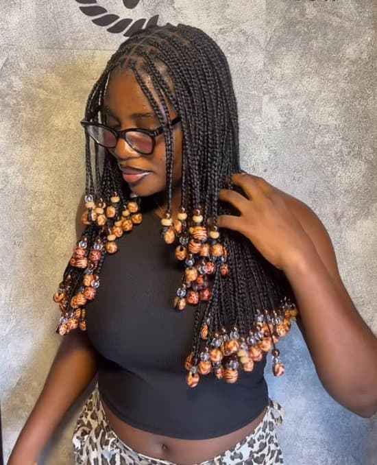 Long Braids Adorned with Ornate Wooden Beads — Simple Hairstyles with Beads