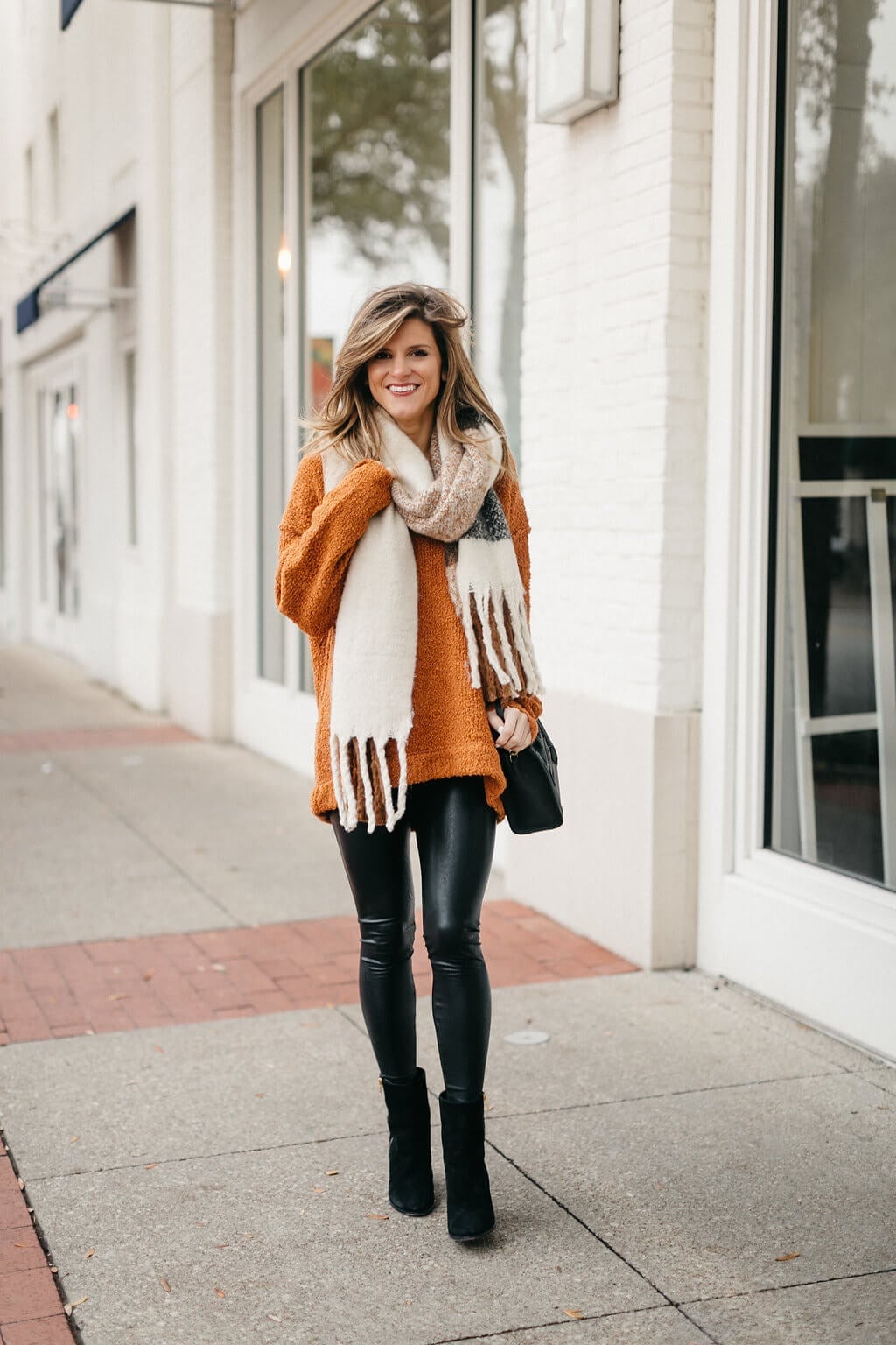 Black Leggings With Orange Sweater And Plaid Scarf — Simple Leggings Outfits Casual