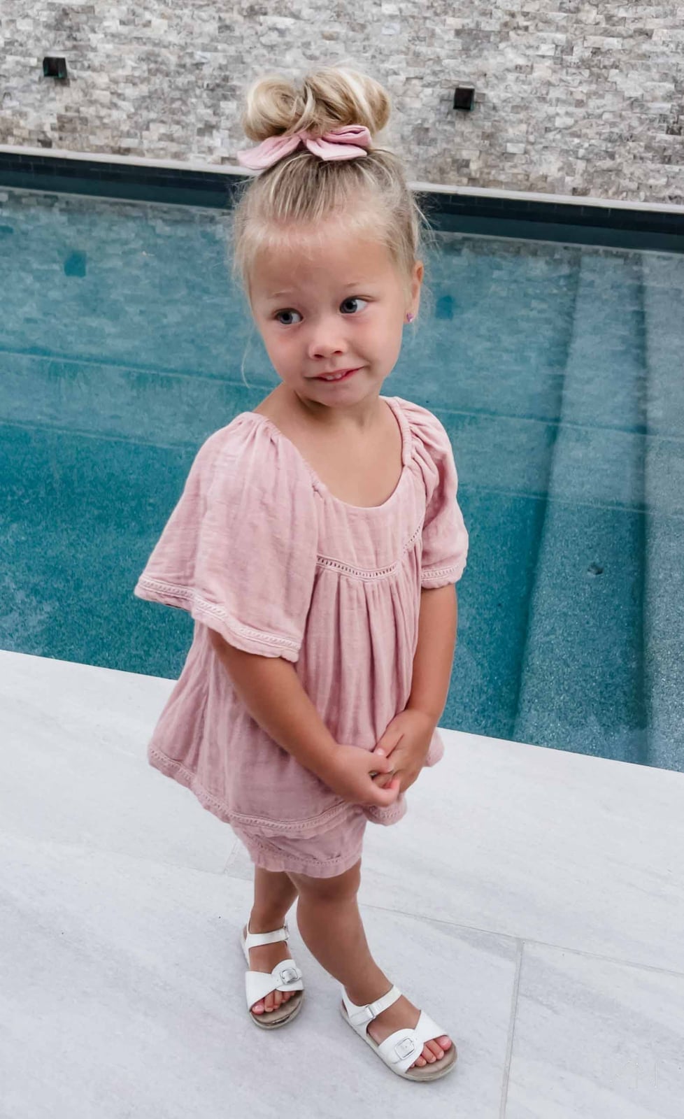 Blonde Collarbone Top Knot Bun With Pink Bow — Simple Little Girl Hairstyles