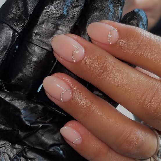 Short Oval Nude With Cuticle Glitter Crescent — Simple Nude Nails