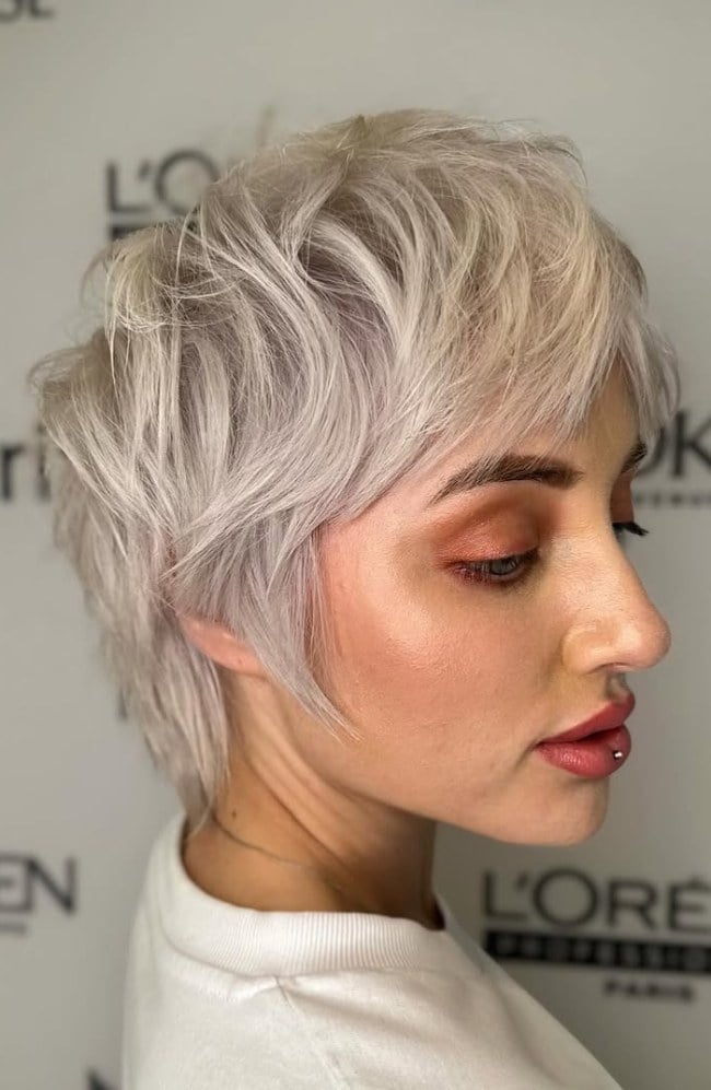 Icy Platinum Pixie Shag With Choppy Bangs Icy Platinum Pixie Shag With Choppy Bangs — Simple Platinum Blonde