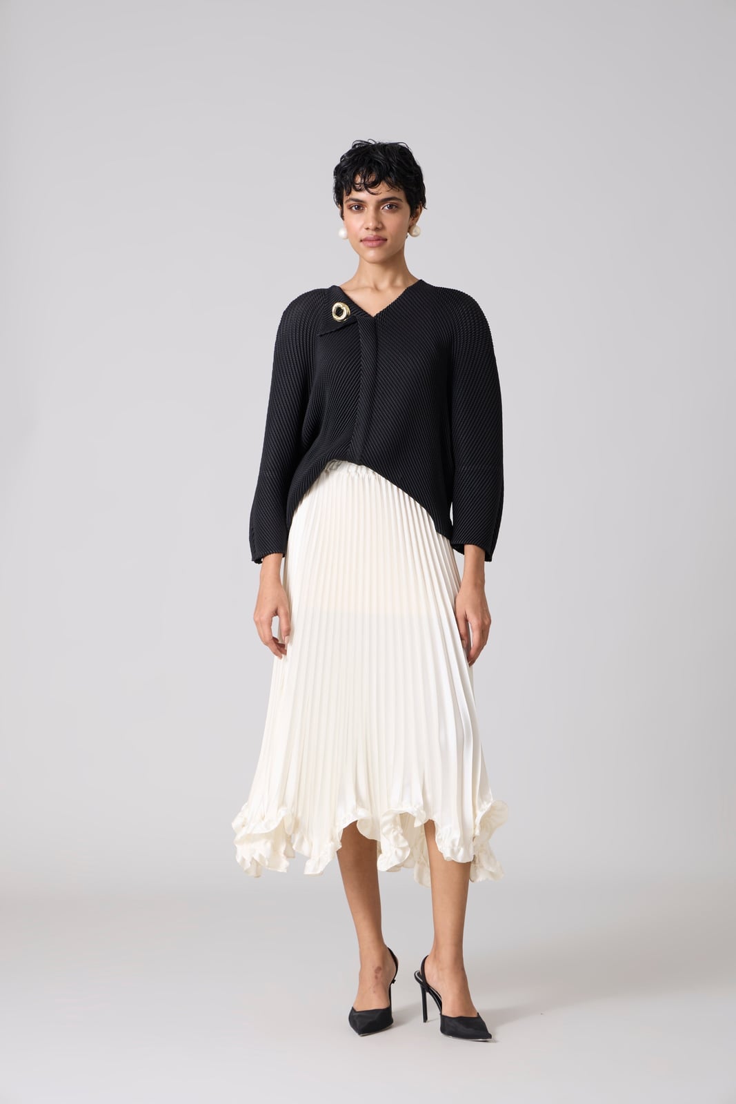 White Pleated Midi Skirt with a Black Cardigan — Simple Pleated Skirt Outfits
