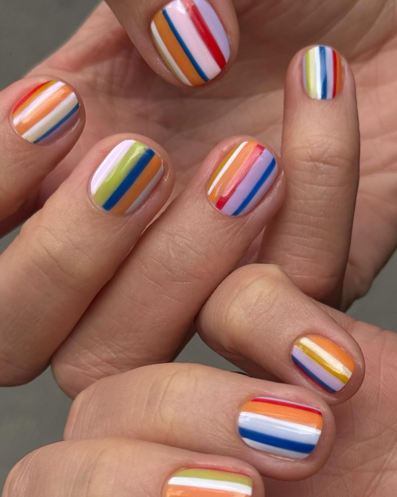 Diagonal Pastel Rainbow Stripes Short Oval — Simple Rainbow Nails