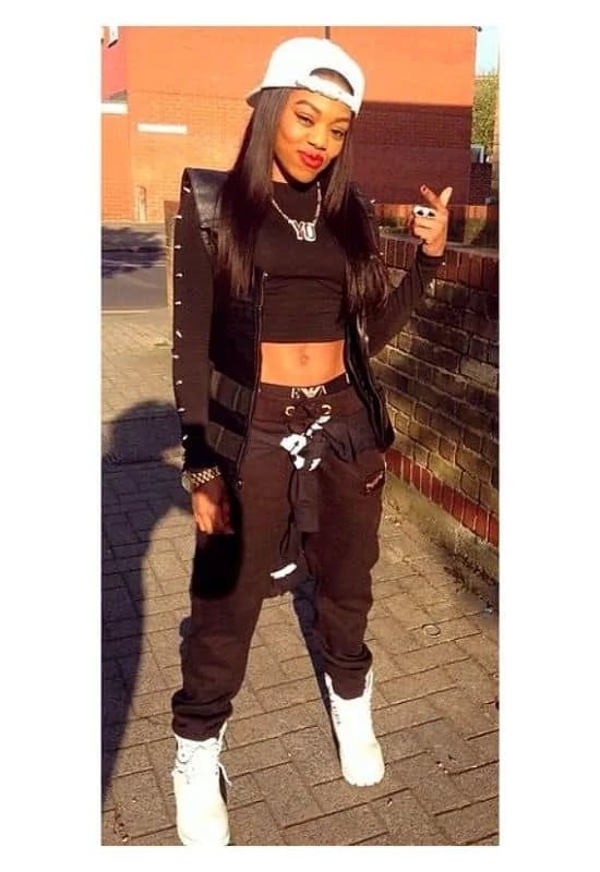 Black Puffer Vest With Loose Black Pants — Simple Rap Concert Outfits
