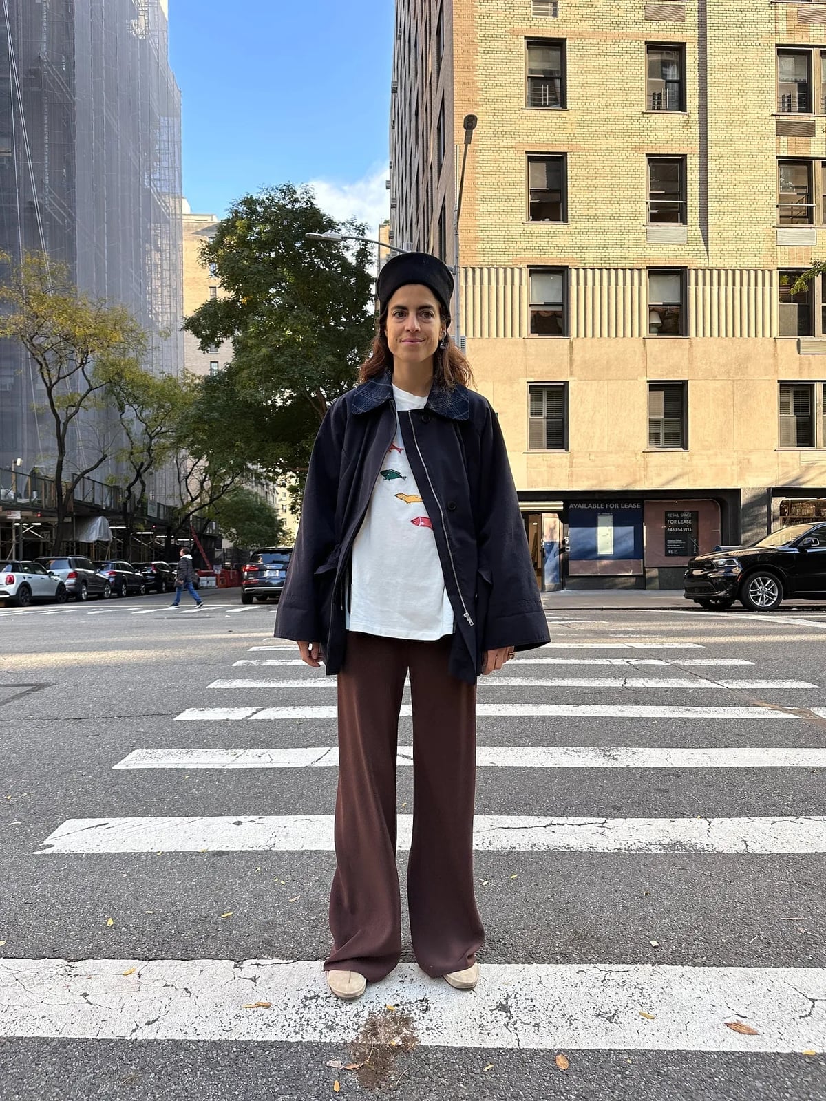 Oversized Navy Jacket with Graphic Tee and Brown Trousers — Simple Road Trip Outfits