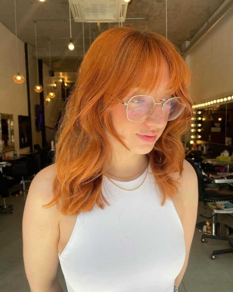 Vibrant Copper Shag With Blunt Bangs Vibrant Copper Shag With Blunt Bangs — Simple Shag Haircut