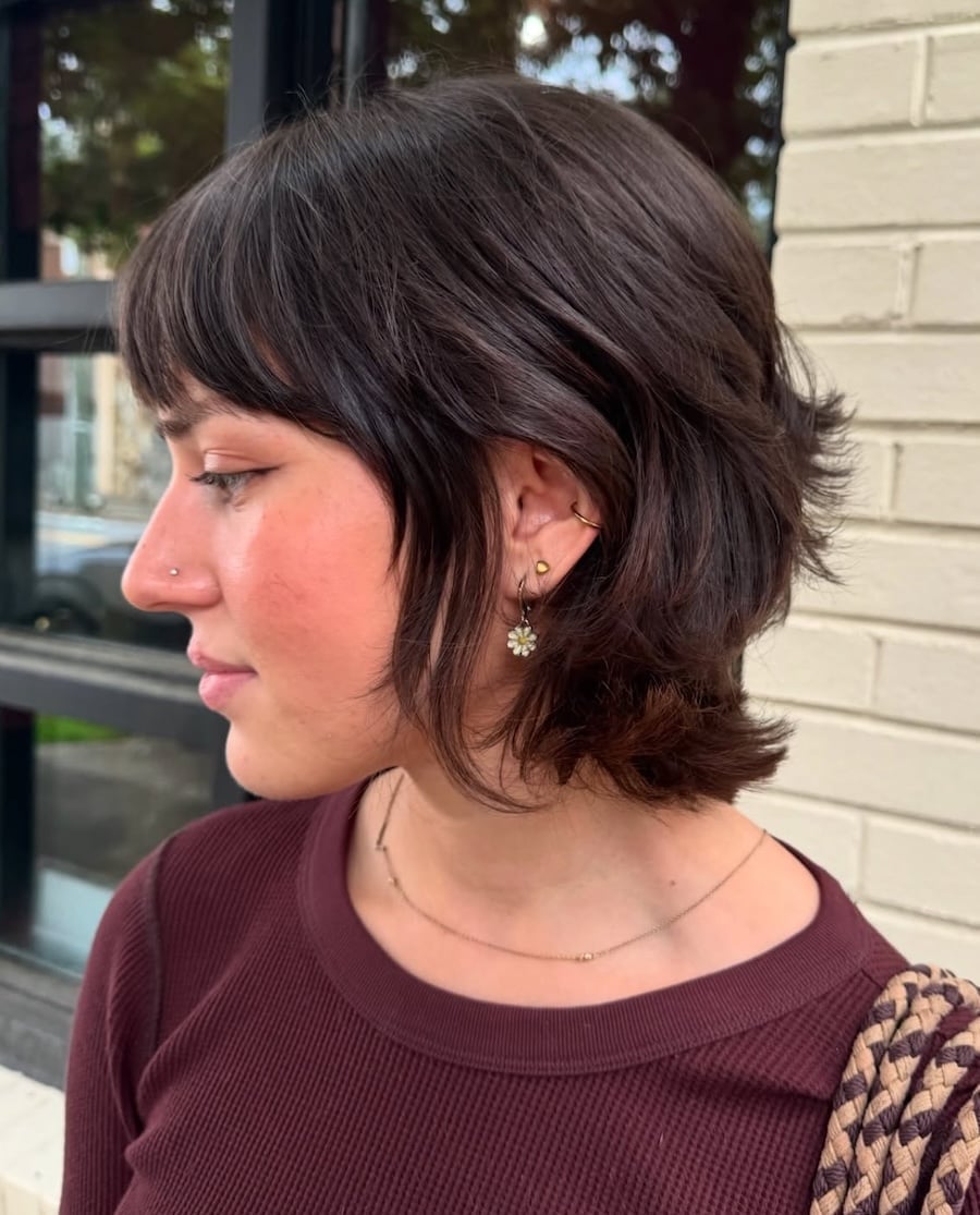 Side View Dark Brown Chin Shaggy Bob With Wispy Bangs — Simple Shaggy Bob Haircut