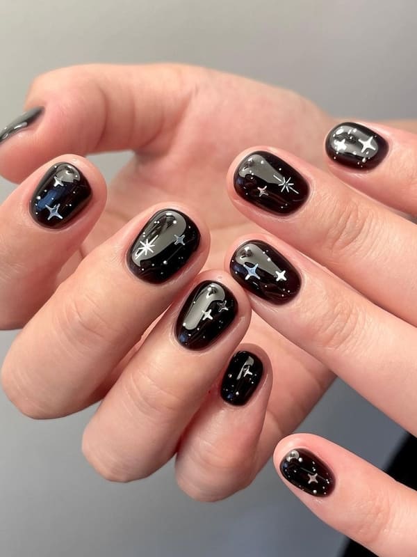 Glossy Black With Silver Star Accents Glossy Black With Silver Star Accents — Simple Short Black Nails