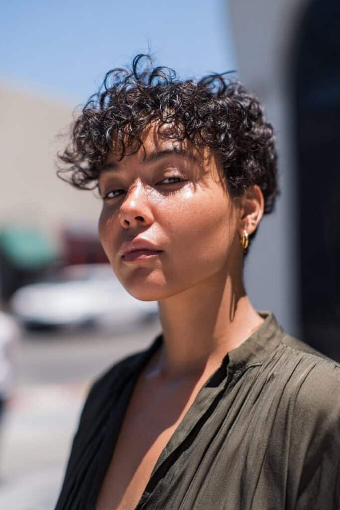 Ear Length Dark Brown Curly Shag With Wispy Bangs and Middle Parting — Simple Short Shag Haircuts