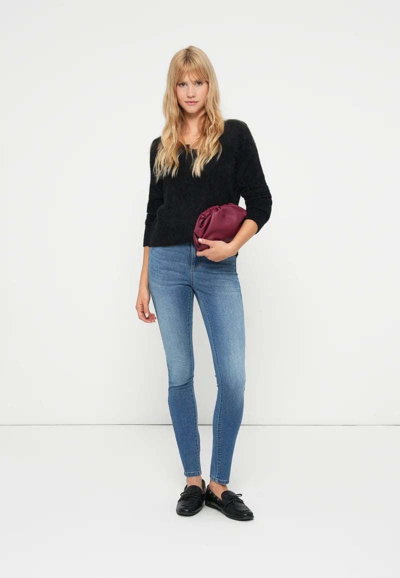 Medium-wash Blue Skinny Jeans with Fuzzy Sweater, Close-Up Take — Simple Skinny Jeans Outfits