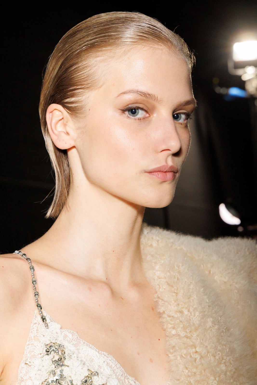 Cream Shearling Coat Draped Over Lace Top — Simple Slicked Back