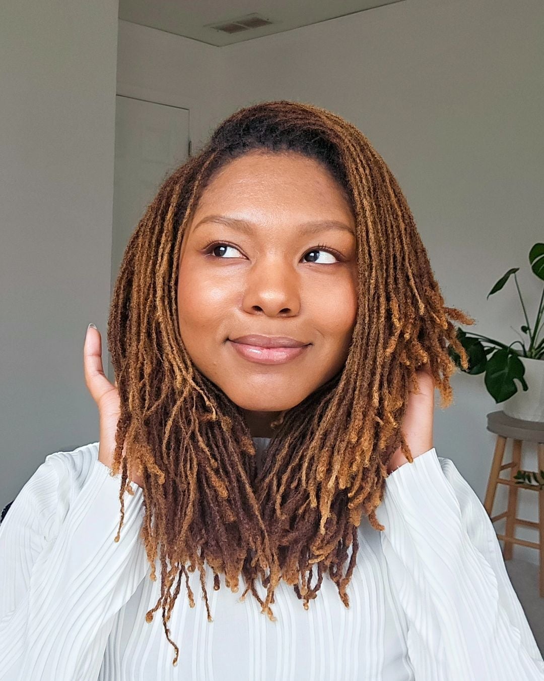 Shoulder Length Black Fine Locs Half Updo Intricate, Close-Up Take Shoulder Length Black Fine Locs Half Updo Intricate, Close-Up Take — Simple Starter Locs