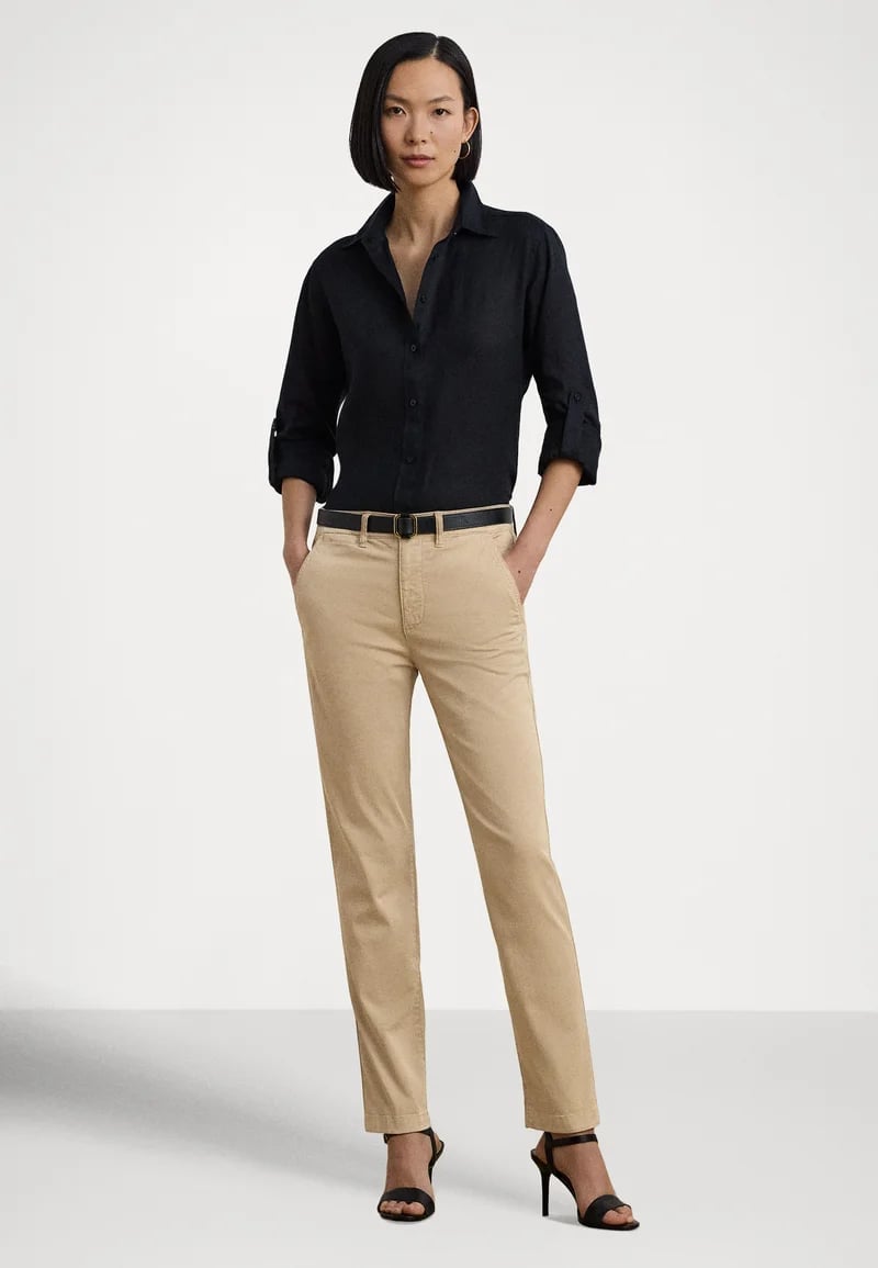 Beige Slim-Fit Chino Pants with a Dark Blue Shirt Beige Slim-Fit Chino Pants with a Dark Blue Shirt — Simple Tan Pants Outfits