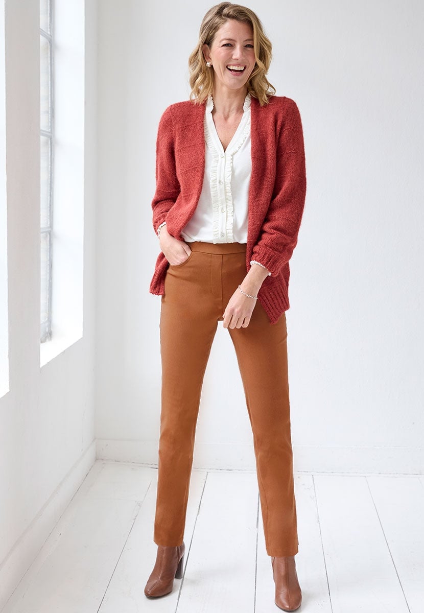 Slim-leg Brown Trousers with a White Ruffled Blouse and Red Cardigan Slim-leg Brown Trousers with a White Ruffled Blouse and Red Cardigan — Simple Tan Pants Outfits