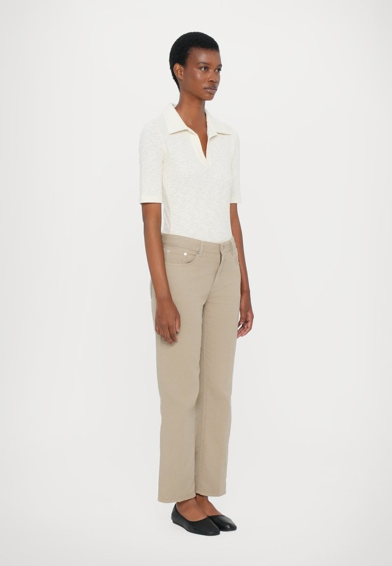 Straight-leg Tan Trousers with a Textured Knit Polo Shirt Straight-leg Tan Trousers with a Textured Knit Polo Shirt — Simple Tan Pants Outfits