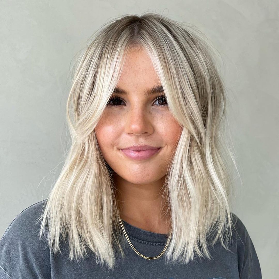 Platinum Blonde Shag With Curtain Bangs — Simple Thinning Hairstyles