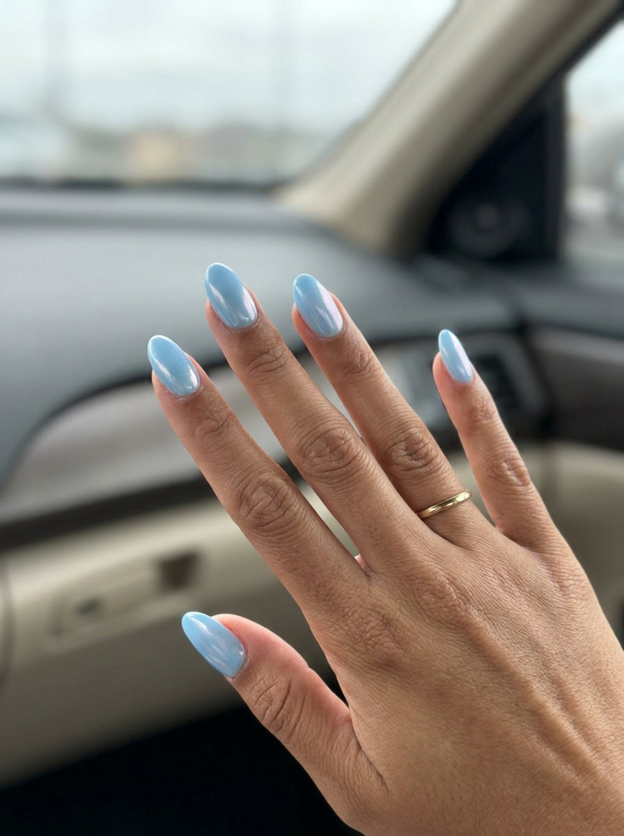 Icy Glazed Sky: Sophisticated summer nail art 2026 with sky blue and pearlescent shimmer for a clean-girl vibe.