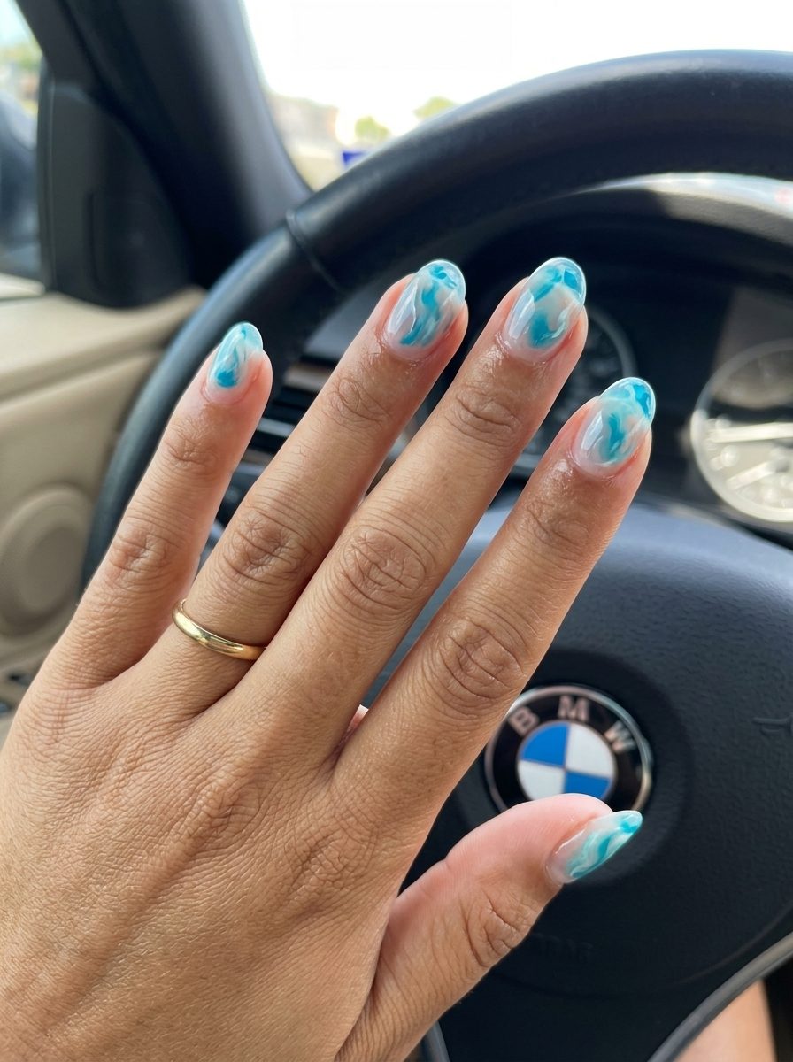 Aqua Swirls Clear Gel nails for summer 2026: whimsical, artistic, outdoor event style.