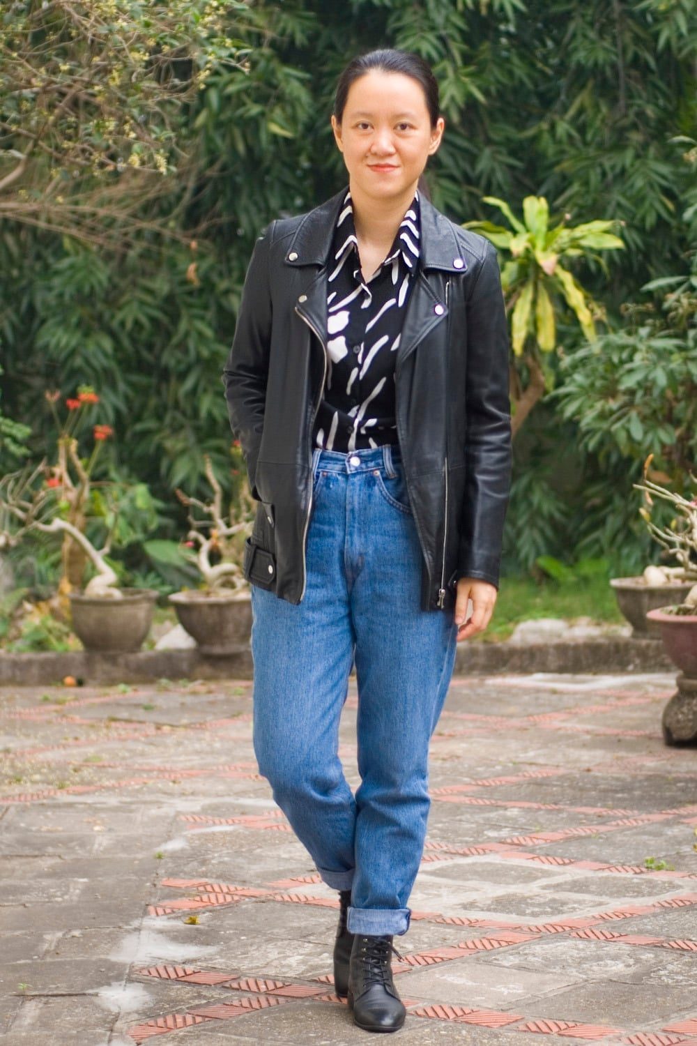 Black Leather Jacket With Striped Shirt and High Waisted Jeans — Trendy 80s Outfits