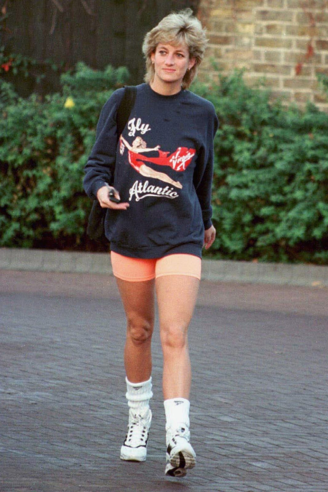 Graphic Sweatshirt With Peach Shorts and Chunky Sneakers — Trendy 80s Outfits
