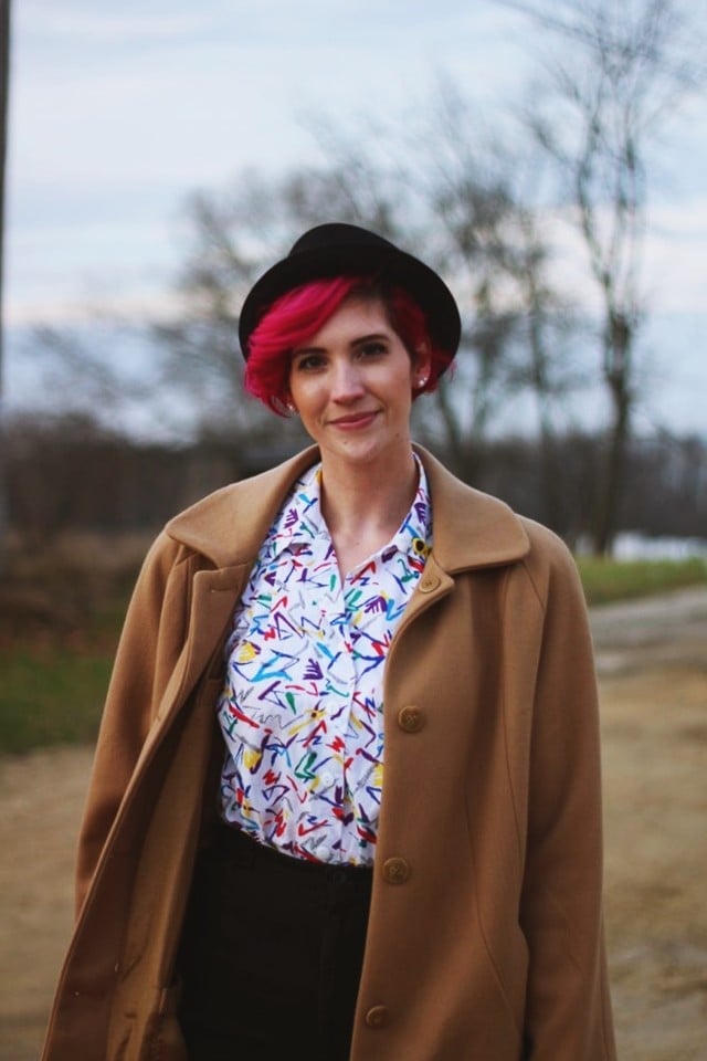 Camel Coat With Geometric Blouse and Black Skirt — Trendy 80s Outfits
