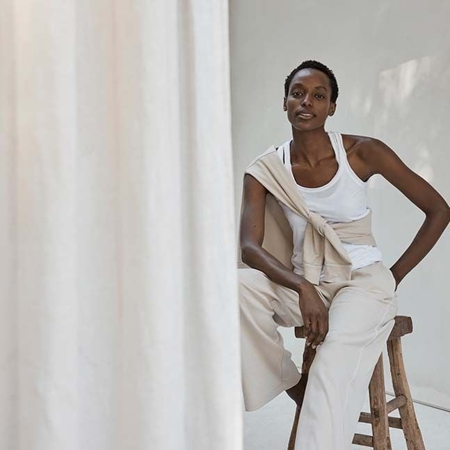 White Tank Top With Beige Sweatshirt And Trousers — Trendy Athleisure Outfits