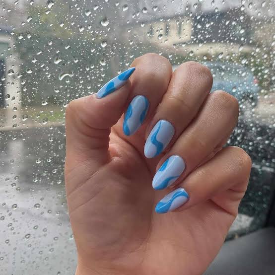 Abstract Swirls Medium Almond Nails — Trendy Baby Blue Nails