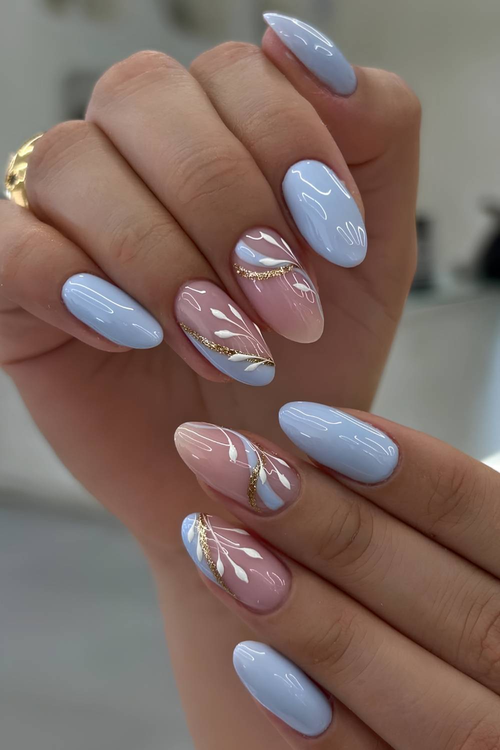 Baby Blue Leaf Motif Short Oval Nails — Trendy Baby Blue Nails