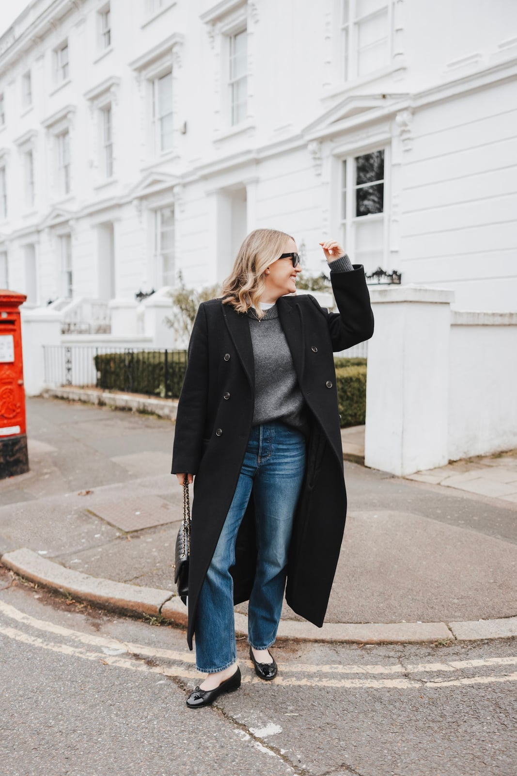 Long Black Coat with Grey Sweater and Straight Leg Jeans — Trendy Ballet Flats Outfits