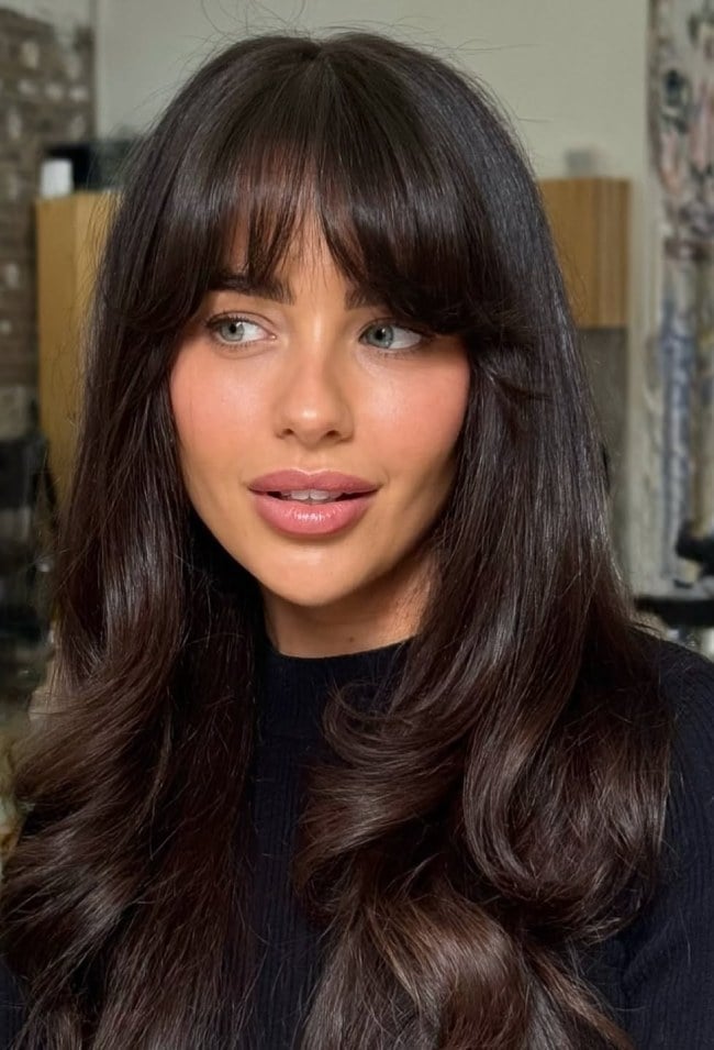 Mid-Back Dark Brown With Glossy Curtain Bangs and Healthy Appearance Mid-Back Dark Brown With Glossy Curtain Bangs and Healthy Appearance — Trendy Bangs Style