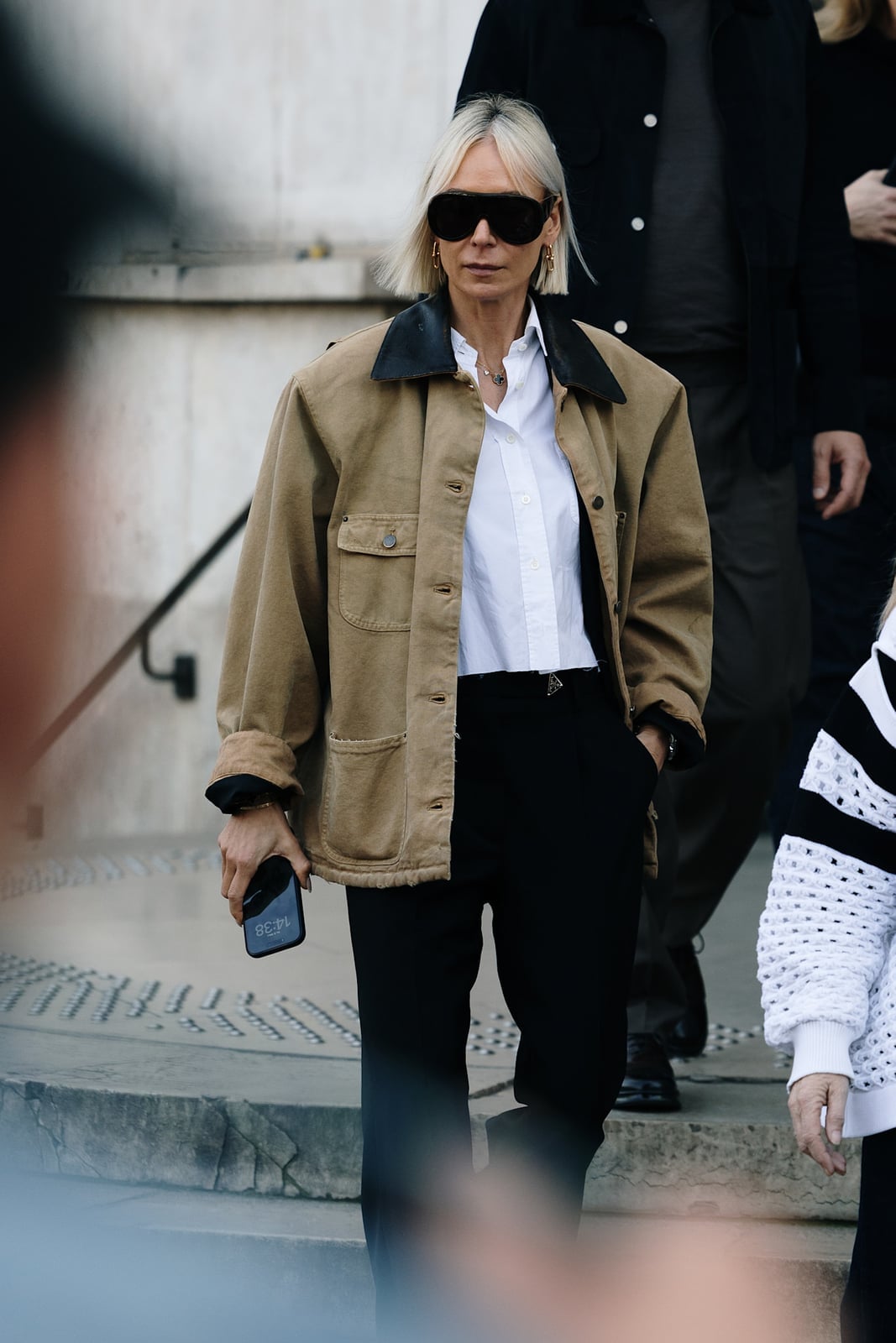Tan Barn Jacket With White Button-Down And Black Trousers — Trendy Barn Jacket Outfit